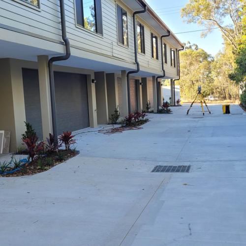 Doing as-constructed survey of final driveway and drainage levels