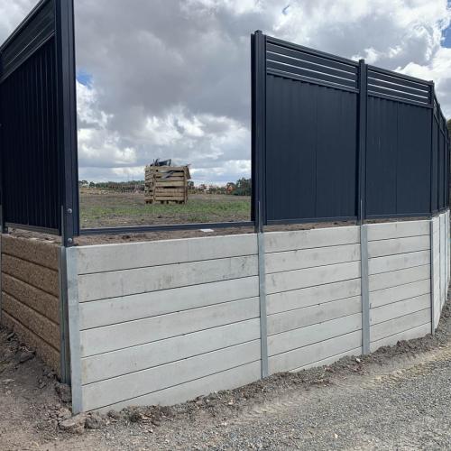 Stage 1 - site retaining wall with metal fencing
