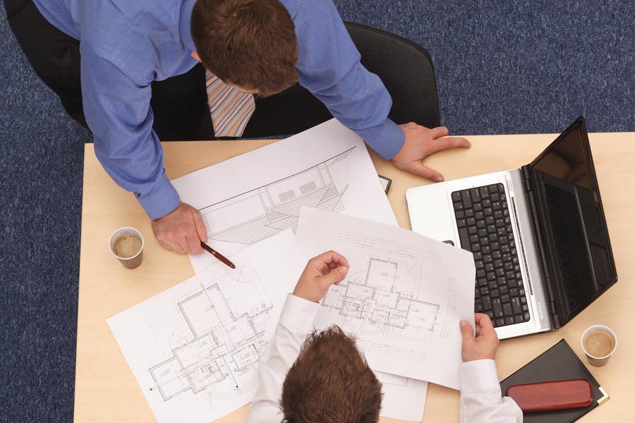 Going over plans on desk